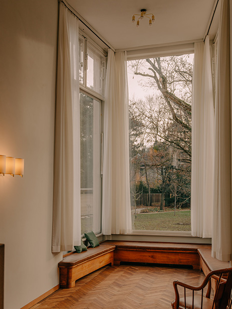 The bay window with a view of the garden after renovation in 2025