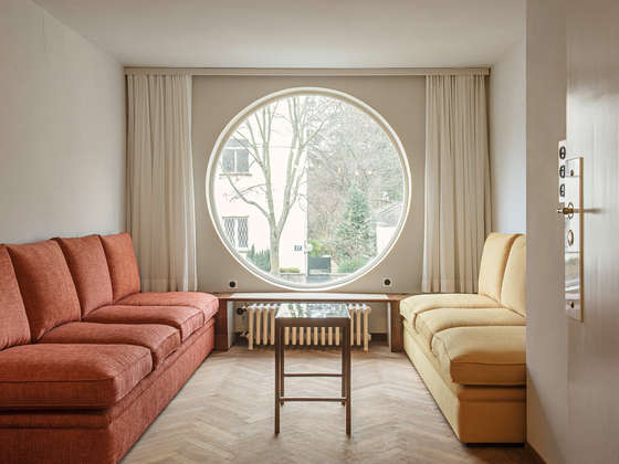 Tea room with round window, 2026