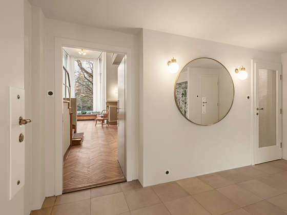 Entrance hall with round mirror, 2025