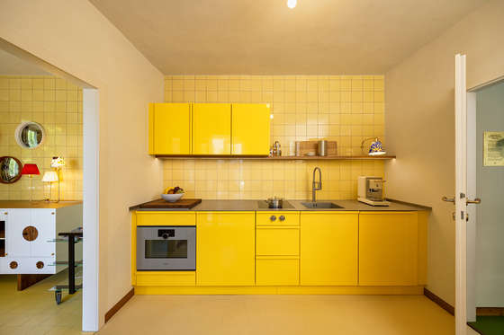 The kitchen was manufactured by Popstahl in a bright shade of yellow.